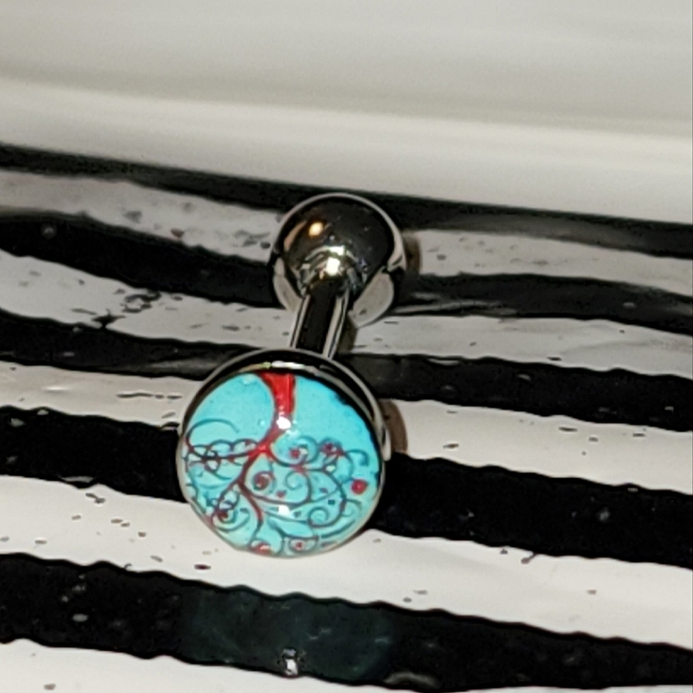 14g swirling tree tongue ring